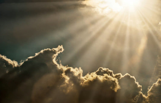 Sunbeams in a clouded sky
